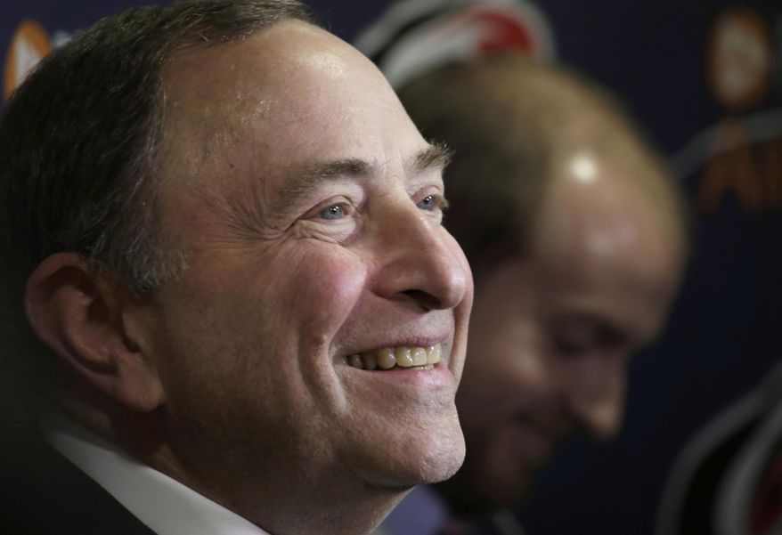 FILE - In this Feb. 26, 2019, file photo, NHL Commissioner Gary Bettman talks to the media before a game between the Carolina Hurricanes and the Los Angeles Kings, in Raleigh, N.C. This has been the postseason of parity with all four division champions gone and the potential that the seventh- and eighth-seeded teams meet in each conference final. This is the world Commissioner Gary Bettman envisioned when the NHL instituted a salary cap in 2005 after a year-long lockout. Bettman prefers to call it “competitive balance,” and it’s the thing he trumpets the most about the state of the league where almost anyone can win the Stanley Cup in a given season. (AP Photo/Chris Seward, File)
