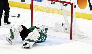 CORRECTS THAT STARS GOALTENDER BISHOP IS LAYING ON THE ICE AS A SHOT BY SCHWARTZ SCORES. DELETES REFERENCE TO BISHOP BEING HIT BY THE PUCK - A shot by St. Louis Blues&#39; Jaden Schwartz scores as Dallas Stars goaltender Ben Bishop lies on the ice  after being injured during the third period in Game 6 of an NHL second-round hockey playoff series, Sunday, May 5, 2019, in Dallas. (AP Photo/Tony Gutierrez) 