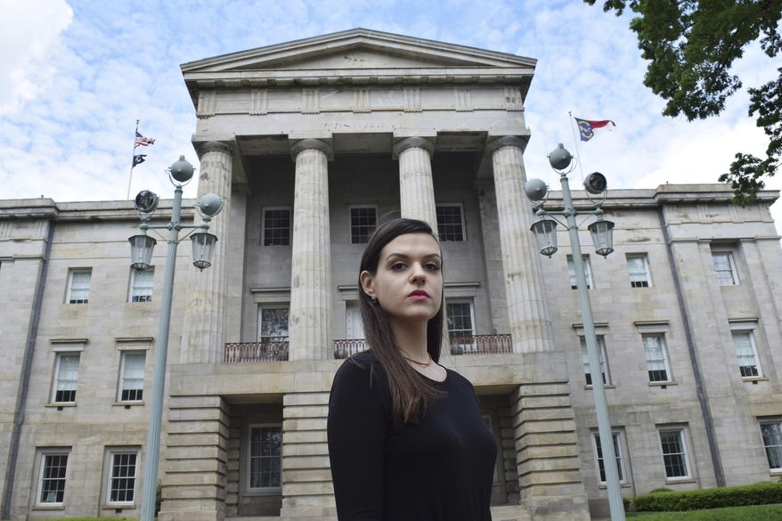 In this April 25, 2019, photo, North Carolina resident Leah McGuirk poses for a photo in Raleigh, N.C. McGuirk is an advocate for a bill that would make it illegal to tamper with someone's drink and would close other loopholes in the state's sexual assault laws. McGuirk experienced a seizure after one of her drinks was drugged in May 2018. (AP Photo/Amanda Morris)