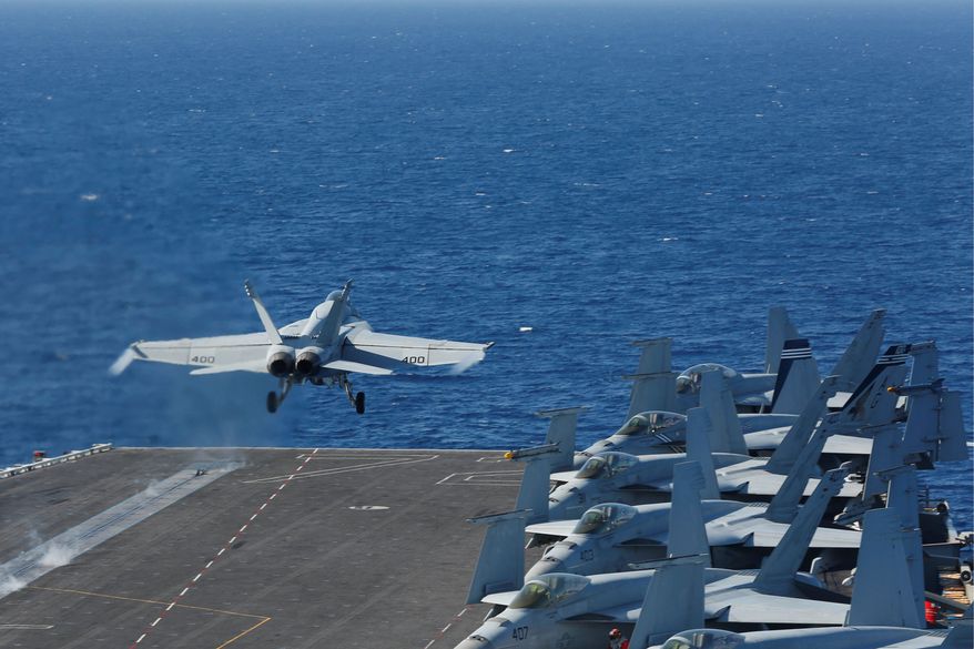 In this May 3, 2019, file photo released by the U.S. Navy, an F/A-18E Super Hornet from VFA 25 launches from the flight deck of the Nimitz-class aircraft carrier USS Abraham Lincoln. The U.S. is dispatching the USS Abraham Lincoln and other military resources to the Middle East following &quot;clear indications&quot; that Iran and its proxy forces were preparing to possibly attack U.S. forces in the region, according to a defense official on May 5, 2019. (Mass Communication Specialist Seaman Michael Singley/US Navy via AP)