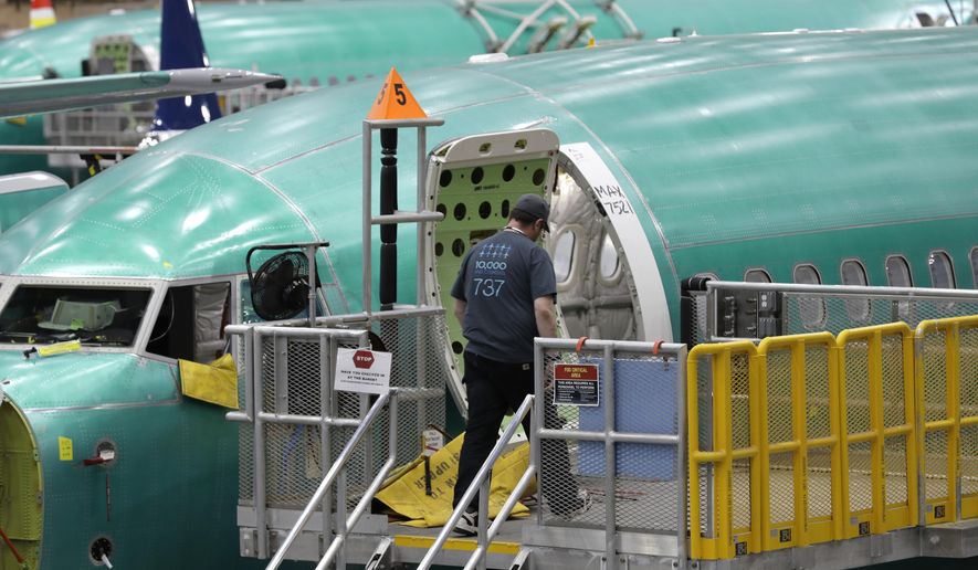 FILE - This March 27, 2019, file photo shows a Boeing 737 MAX 8 airplane on the assembly line during a brief media tour of Boeing's 737 assembly facility in Renton, Wash. Recent crashes have caused an uptick in airline fatalities in 2018 and 2019 after a long trend of safer flying. Boeing 737 Max accidents have raised concern over the ability of all pilots to handle automation. Still, aviation deaths are down sharply from the 1990s, and experts credit advances in aircraft and airport design, better air traffic control, and more pilot training. (AP Photo/Ted S. Warren, File)