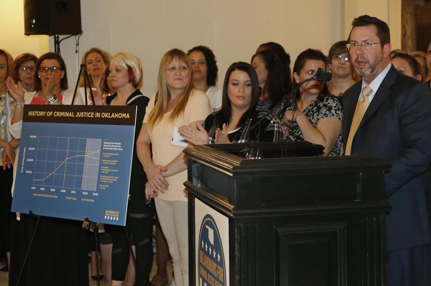 FILE - In this Tuesday, April 16, 2019 file photo, former Republican House Speaker Kris Steele, right, addresses a group of criminal justice reform advocates at the state Capitol in Oklahoma City. Supporters of changes in Oklahoma's criminal justice system say court fines and fees are levied on people unable to pay them in order to support government functions. (AP Photo/Sue Ogrocki, File)