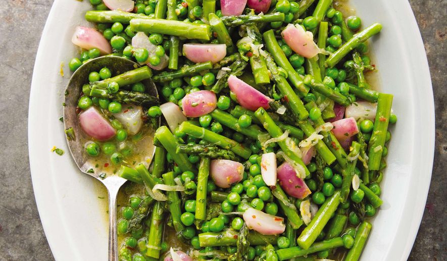 This undated photo provided by America's Test Kitchen in April 2019 shows Braised Spring Vegetables with Tarragon in Brookline, Mass. This recipe appears in the cookbook “How to Braise Everything.” (Joe Keller/America's Test Kitchen via AP)