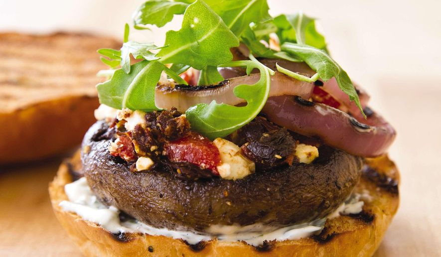 This undated photo provided by America's Test Kitchen in April 2019 shows a Grilled Portobello Burger in Brookline, Mass. This recipe appears in the cookbook “Vegetables Illustrated.” (Joe Keller/America's Test Kitchen via AP)