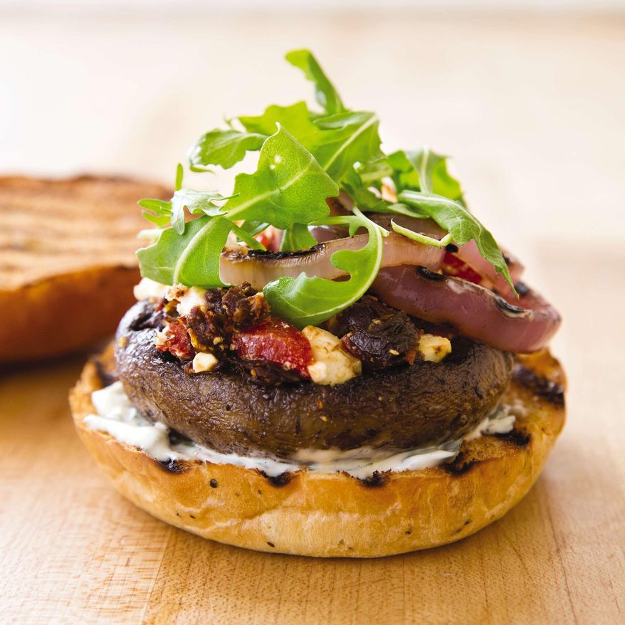 This undated photo provided by America's Test Kitchen in April 2019 shows a Grilled Portobello Burger in Brookline, Mass. This recipe appears in the cookbook “Vegetables Illustrated.” (Joe Keller/America's Test Kitchen via AP)