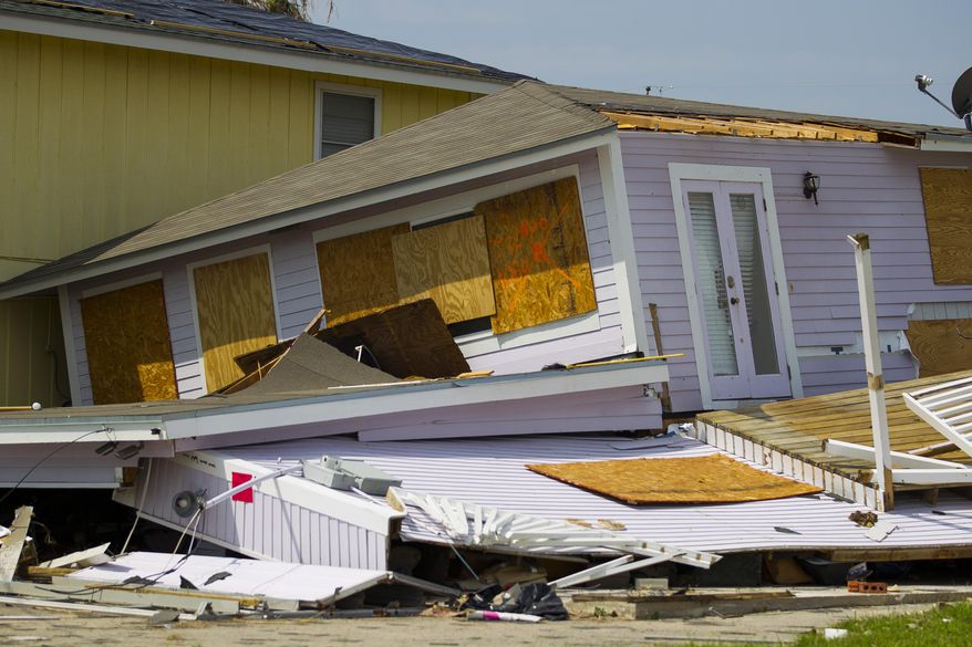 A destroyed house leans against its neighbor in Rockport, Texas, Wednesday, Sept. 13, 2017. Rockport took a direct hit from Hurricane Harvey on August 25, 2017. Lawmakers are considering a bill that could grant Texas homeowners a tax break when their property has been damaged by disasters such as 2017’s Hurricane Harvey. (Mark Mulligan/Houston Chronicle via AP)