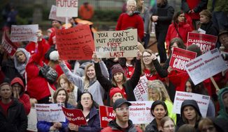 In this April 10, 2019 photo educators from across the metro are gathered at Pioneer Courthouse Square to press the Oregon Legislature for more school funding. Tens of thousands of teachers are expected to walk out across Oregon this week, adding to the string of nationwide protests over class sizes and education funding. Schools around the state, including Oregon&#39;s largest district, Portland Public Schools, will close for at least part of Wednesday, May 8, 2019 as educators press for more money from lawmakers. (Mark Graves/The Oregonian via AP)