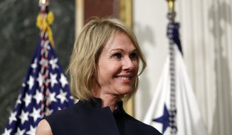 In this Sept. 26, 2017, file photo, U.S. Ambassador to Canada Kelly Knight Craft stands during her swearing in ceremony in the Indian Treaty Room in the Eisenhower Executive Office Building on the White House grounds in Washington. Ms. Craft, nominated by President Trump to be ambassador to the UN, is coming under heightened scrutiny by Democrats on the Seneate Foreign Relations Committee, who question her qualifications, credibility and alleged conflicts of interest.  (AP Photo/Alex Brandon, File) **FILE**