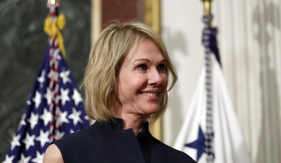 In this Sept. 26, 2017, file photo, U.S. Ambassador to Canada Kelly Knight Craft stands during her swearing in ceremony in the Indian Treaty Room in the Eisenhower Executive Office Building on the White House grounds in Washington. Ms. Craft, nominated by President Trump to be ambassador to the UN, is coming under heightened scrutiny by Democrats on the Seneate Foreign Relations Committee, who question her qualifications, credibility and alleged conflicts of interest.  (AP Photo/Alex Brandon, File) **FILE**