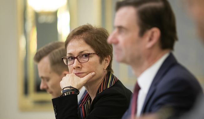 U.S. Ambassador to Ukraine Marie Yovanovitch, center, sits during her meeting with Ukrainian President Petro Poroshenko in Kyiv, Ukraine, Wednesday, March 6, 2019. Yovanovitch directed unusually scathing criticism at the Ukrainian government in remarks released Wednesday, urging authorities to replace a senior anti-corruption official and tackle the country&#x27;s corruption problem. (Mikhail Palinchak, Presidential Press Service Pool Photo via AP) ** FILE **