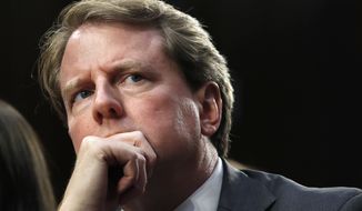 In this Sept. 4, 2018, file photo, then-White House counsel Don McGahn, listens as he attends a confirmation hearing for Supreme Court nominee Brett Kavanaugh before the Senate Judiciary Committee on Capitol Hill in Washington. (AP Photo/Jacquelyn Martin) ** FILE **