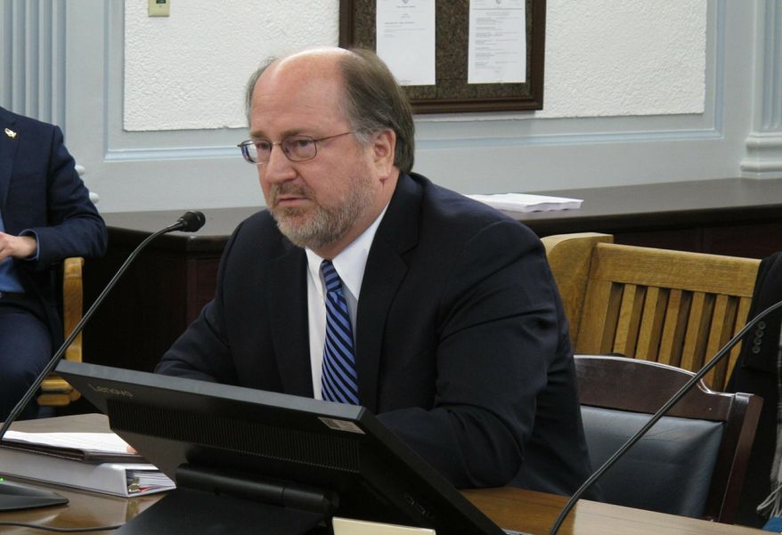 FILE - In this Jan. 29, 2019 file photo, Alaska Attorney General Kevin Clarkson testifies before state senators during a confirmation hearing in Juneau, Alaska. Clarkson says his life was likely saved by one simple act. He suspected he was having a heart attack on a flight to Seattle on April 26, 2019, but didn't want to bother anyone. But a half hour before the plane landed, he pushed the call button for a flight attendant, the likely life-saving event. (AP Photo/Becky Bohrer, File)