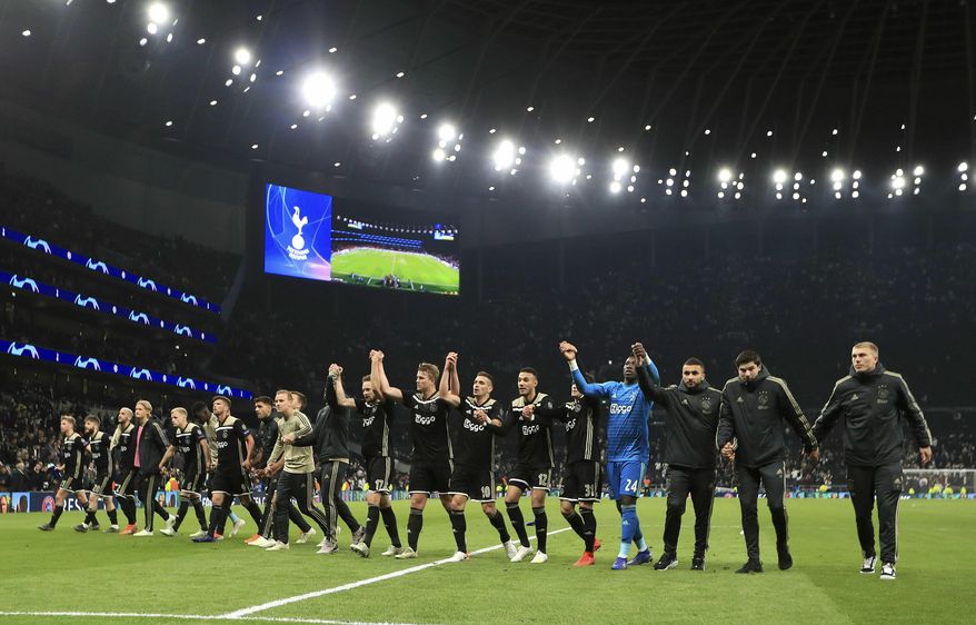 Ajax players celebrate after the final whistle of the Champions League, semifinal first leg soccer match at the Tottenham Hotspur Stadium, London, Tuesday April 30, 2019. Ajax beat Tottenham 1-0. (Mike Egerton/PA via AP)