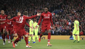 Liverpool&#39;s Divock Origi, center, celebrates scoring his side&#39;s fourth goal of the game during the Champions League Semi Final, second leg soccer match between Liverpool and Barcelona at Anfield, Liverpool, England, Tuesday, May 7, 2019. (Peter Byrne/PA via AP)