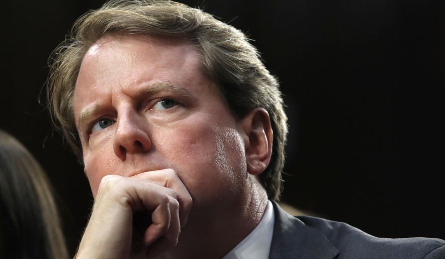 FILE - In this Sept. 4, 2018 file photo, White House counsel Don McGahn, listens as he attends a confirmation hearing for Supreme Court nominee Brett Kavanaugh before the Senate Judiciary Committee on Capitol Hill in Washington.  (AP Photo/Jacquelyn Martin)