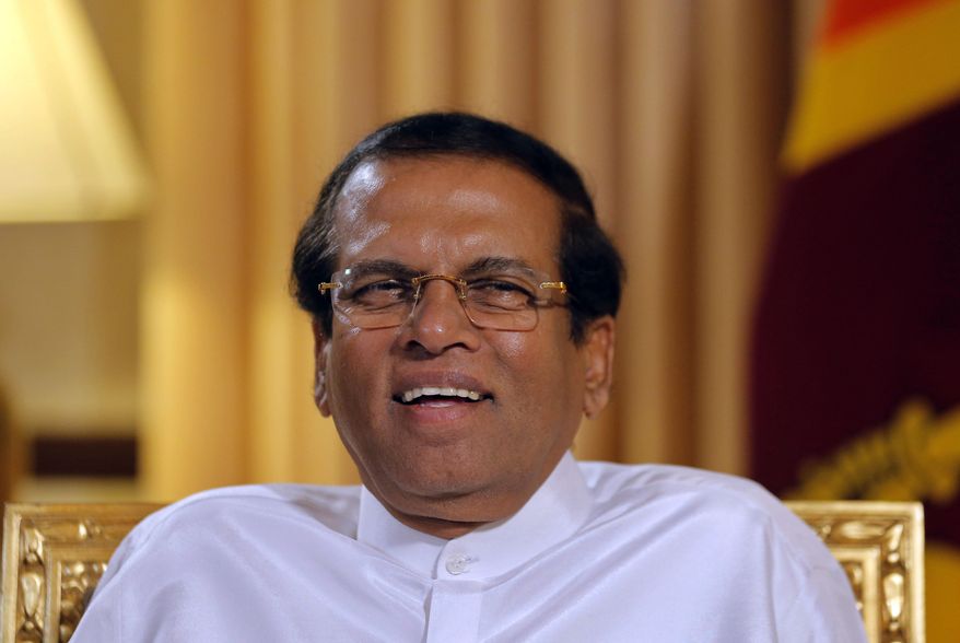 Sri Lankan President Maithripala Sirisena smiles during an interview with the Associated Press at his residence in Colombo, Sri Lanka, Tuesday, May 7, 2019. Sirisena says “99%” of the suspects in Easter Sunday attacks on churches and hotels have been arrested and their explosive materials seized. (AP Photo/Eranga Jayawardena)