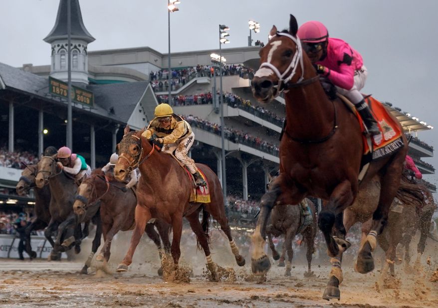 Luis Saez rides Maximum Security, right, across the finish line first against Flavien Prat on Country House during the 145th running of the Kentucky Derby horse race at Churchill Downs Saturday, May 4, 2019, in Louisville, Ky. Country House was declared the winner after Maximum Security was disqualified following a review by race stewards. (Associated Press)