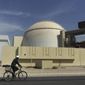 FILE - In this Oct. 26, 2010 file photo, a worker rides a bike in front of the reactor building of the Bushehr nuclear power plant, outside Bushehr, Iran. Iran’s President Hassan Rouhani is reportedly set to announce ways the Islamic Republic will react to continued U.S. pressure after President Donald Trump pulled America from Tehran’s nuclear deal with world powers. Iranian media say Rouhani is expected to deliver a nationwide address as soon as Wednesday, May 8, 2019, regarding the steps the country will take. (AP Photo/Majid Asgaripour/Mehr News Agency, File)