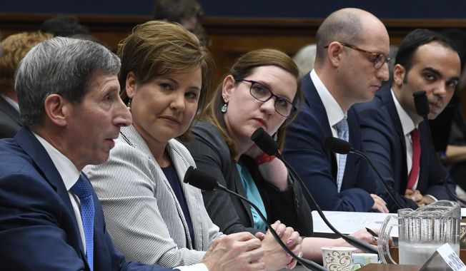 Federal Trade Commission Chairman Joseph Simons, left, testifies during a House Energy and Commerce subcommittee hearing on Capitol Hill in Washington, Wednesday, May 8, 2019, regarding consumer protection on data privacy. Simons is joined at the witness table by, from left, FTC Commissioners Christine Wilson, Rebecca Kelly Slaughter, Noah Joshua Phillips and Rohit Chopra. (AP Photo/Susan Walsh)