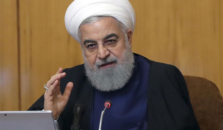 In this photo released by the official website of the office of the Iranian Presidency, President Hassan Rouhani speaks in a Cabinet meeting in Tehran, Iran, Wednesday, May 8, 2019. Rouhani said Wednesday that it will begin keeping its excess uranium and heavy water from its nuclear program, setting a 60-day deadline for new terms to its nuclear deal with world powers before it will resume higher uranium enrichment. (Iranian Presidency Office via AP)