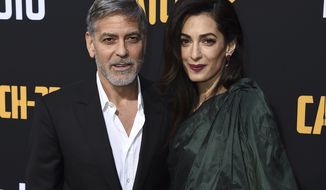 George Clooney and Amal Clooney arrive at the Los Angeles premiere of &amp;quot;Catch-22&amp;quot; at TCL Chinese Theatre on Tuesday, May 7, 2019. (Photo by Jordan Strauss/Invision/AP)