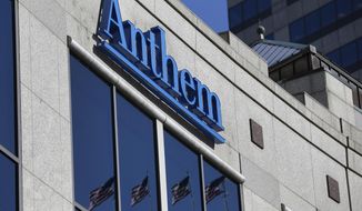 FILE - This Feb. 5, 2015, file photo shows the Anthem logo at the health insurer&#39;s corporate headquarters in Indianapolis. The Justice Department says a grand jury has indicted Fujie Wang and another Chinese man identified only as John Doe for hacking into the computers of health insurer Anthem Inc. and three other, unnamed companies, in an indictment unsealed Thursday, May 9, 2019, in Indianapolis. (AP Photo/Michael Conroy, File)