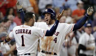 Houston Astros&#39; Carlos Correa (1) and George Springer (4) celebrate Springer&#39;s home run during the third inning of the team&#39;s baseball game against the Texas Rangers on Thursday, May 9, 2019, in Houston. (AP Photo/Michael Wyke)