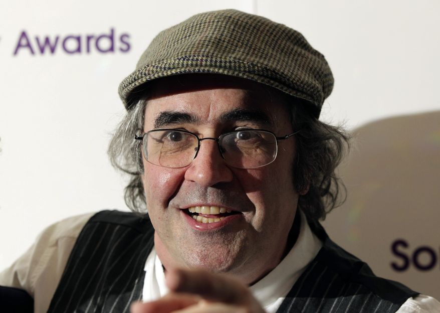 In this May 13, 2013, file photo, Danny Baker poses for a photo in London. A BBC DJ has been fired after using a picture of a chimpanzee in a tweet about the royal baby born to Meghan the Duchess of Sussex and her husband Prince Harry. Baker tweeted Thursday, May 9, 2019, that he has been fired after posting an image of a couple holding hands with a chimpanzee dressed in clothes and the caption: "Royal baby leaves hospital." (Yui Mok/PA via AP, file)