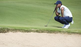 Brooks Koepka lines up to putt on the first green during the first round of the Byron Nelson golf tournament Thursday, May 9, 2019, at Trinity Forest in Dallas. (Ryan Michalesko/The Dallas Morning News via AP)
