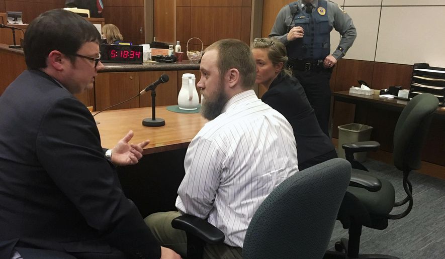 FILE - In this Dec. 14, 2018, file photo, Christopher Sadowski, center, confers with his public defender, Justin Racette, left, after hearing his guilty verdict at the Rabinowitz Courthouse in Fairbanks, Alaska. Sadowski was convicted of first-degree murder in the death of his 4-year-old son, Christopher Sadowski Jr., and was sentenced Monday, May 6, 2019, to 90 years in prison. (Dorothy Chomicz/Fairbanks Daily News-Miner via AP, File)
