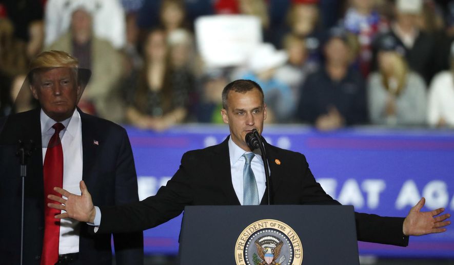 In this April 28, 2018, file photo, President Donald Trump, left, watches as Corey Lewandowski, right, his former campaign manager for the Trump&#x27;s presidential campaign, speaks during a campaign rally in Washington Township, Mich.  (AP Photo/Paul Sancya, File) **FILE**