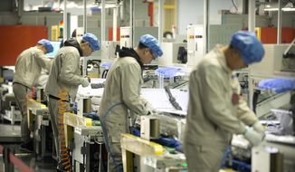 In this Feb. 24, 2017, photo, factory workers assemble the cases on air conditioners on an assembly line at a Haier factory in Jiaozhou near Qingdao in eastern China&#39;s Shandong Province. U.S. President Donald Trump&#39;s latest tariff hike on Chinese goods took effect Friday, May 10, 2019, and Beijing said it would retaliate, escalating a battle over China&#39;s technology ambitions and other trade tensions. (AP Photo/Mark Schiefelbein)