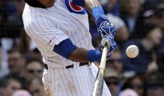 Chicago Cubs&#39; Addison Russell hits a double during the seventh inning of a baseball game against the Milwaukee Brewers, Friday, May 10, 2019, in Chicago. (AP Photo/Nam Y. Huh)