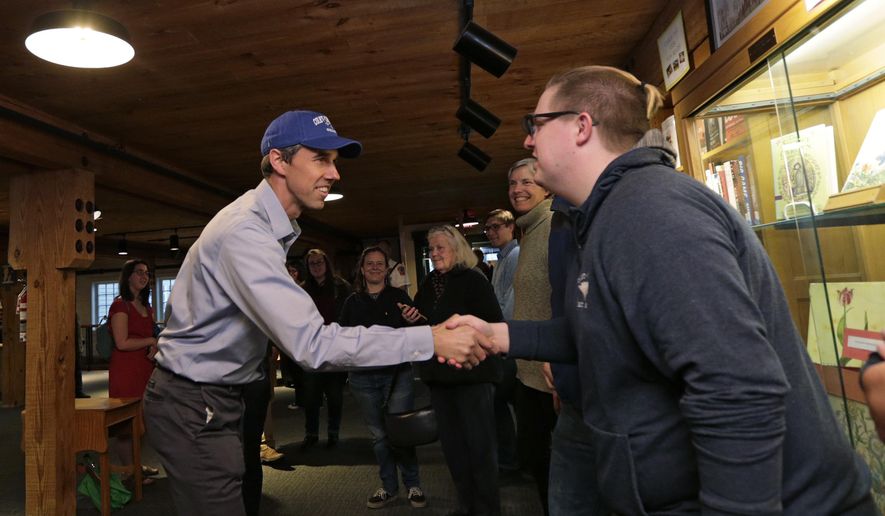 Democratic presidential candidate and former Texas Congressman Beto O&#39;Rourke shakes hands with a guest while arriving at a campaign stop at Colby-Sawyer College in New London, N.H., Friday, May 10, 2019. (AP Photo/Charles Krupa)