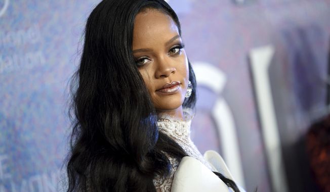FILE - In this Sept. 13, 2018 file photo, singer Rihanna attends the 4th annual Diamond Ball at Cipriani Wall Street in New York. Rihanna is partnering with LVMH Moët Hennessy Louis Vuitton to launch a new fashion label. The pop star, born Robyn Rihanna Fenty, announced Friday, May 10, 2019, that a new line called Fenty will debut this spring and will be based in Paris.   (Photo by Evan Agostini/Invision/AP, File)