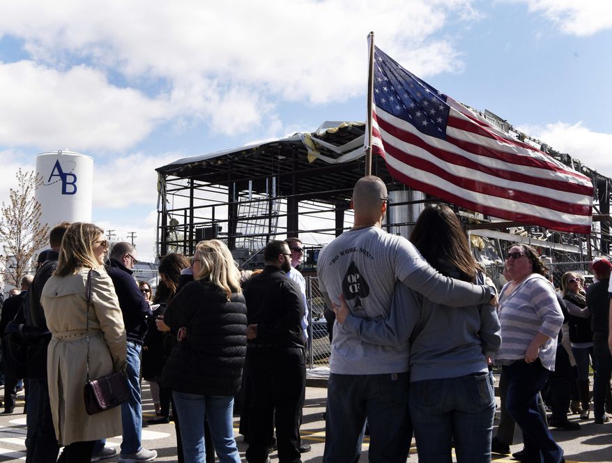 Attendees listen during a memorial, Friday morning, May 10, 2019, in Waukegan, Ill. , for the victims of a recent explosion at the AB Specialty Silicones plant. (Joe Lewnard/Daily Herald via AP)