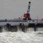 The Bonnet Carre Spillway has been open for nearly 100 days to divert rising water from the Mississippi River to Lake Pontchartrain, upriver from New Orleans. (Associated Press/File)