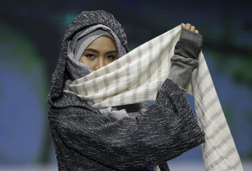 A model displays a creation by Rosie Rahmadi during the Muslim Fashion Festival in Jakarta, Indonesia, May 3, 2019. The event was held to greet the upcoming holy fasting month of Ramadan. (AP Photo/Achmad Ibrahim)  ** FILE **