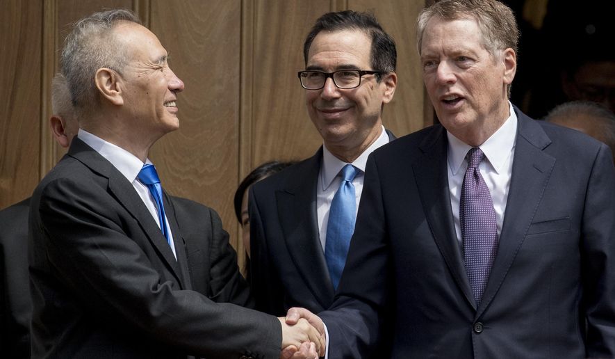 Treasury Secretary Steve Mnuchin, center, and United States Trade Representative Robert Lighthizer, right, speak with Chinese Vice Premier Liu He, left, as he departs the Office of the United States Trade Representative in Washington, Friday, May 10, 2019. (AP Photo/Andrew Harnik)