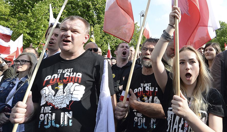 Thousands of Polish nationalists march to the U.S. Embassy, in Warsaw, Poland, Saturday, May 11, 2019. Thousands of Polish nationalists have marched to the U.S. Embassy in Warsaw, protesting that the U.S. is putting pressure on Poland to compensate Jews whose families lost property during the Holocaust. The protesters included far-right groups and their supporters. They said the United States has no right to interfere in Polish affairs and that the U.S. government is putting &quot;Jewish interests&quot; over the interests of Poland. The T-shirts read in Polish &quot;This is Poland not Polin&quot; (AP Photo/Czarek Sokolowski)