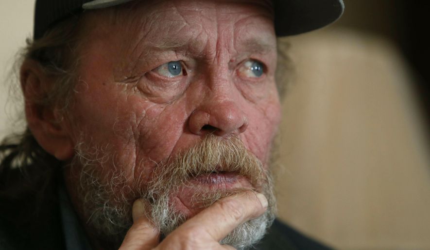 In this Friday, March 22, 2019 photo, Allan Votaw, 66, pauses as he recalls and describes the years of abuse he suffered at the Cal Farley's Boys Ranch during an interview at this home in Kingston, Okla. Votow says his childhood years of 1957-1967 at the famed ranch near Amarillo, Texas were marked with horrible abuses against himself, his two brothers and numerous other boys placed under care of the rural institution. (AP Photo/LM Otero)