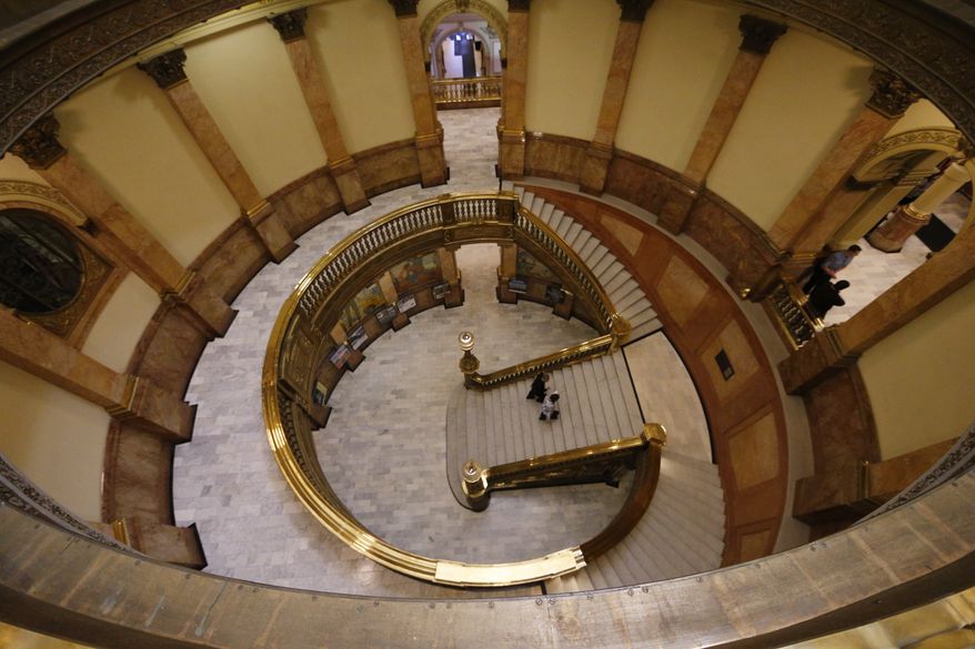 Visitors make their way up the main steps under the dome of the Colorado state Capitol, Wednesday, Feb. 24, 2016, in Denver. (AP Photo/David Zalubowski)
