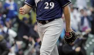 Milwaukee Brewers relief pitcher Burch Smith leaves the field after Chicago Cubs&#39; Willson Contreras hit the game-winning solo home run during the 15th inning of a baseball game Saturday, May 11, 2019, in Chicago. The Cubs won 2-1. (AP Photo/Nam Y. Huh)