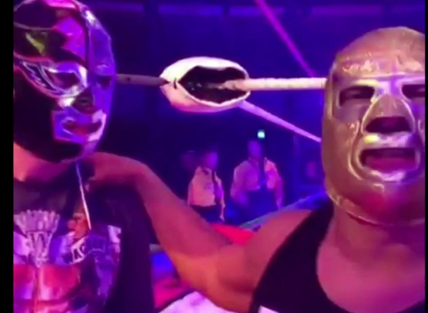 In this image made from video taken on Saturday, May 11, 2019, The Silver King, right, talks to the camera with fan Mark van der Enden at the Roundhouse in London. A fan of a wrestler and actor who died after collapsing on stage mid-performance in London shared the moment he got to meet his idol earlier that afternoon. Cesar Cuauhtemoc Gonzalez Barron, also known by his wrestling title of Silver King, died of a suspected heart attack at the Roundhouse in London's Camden on Saturday night, promoters said. (@estefyunvin via AP)