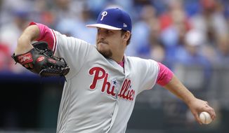 Philadelphia Phillies starting pitcher Cole Irvin throws during the first inning of a baseball game against the Kansas City Royals, Sunday, May 12, 2019, in Kansas City, Mo. (AP Photo/Charlie Riedel)