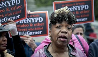 In this Thursday May 9, 2019 photo, Gwen Carr, left, mother of Eric Garner- an unarmed black man who died as he was being subdued in a chokehold by police officer Daniel Pantaleo nearly five years ago, speak during a press conference after leaving court in New York. A judge cleared the way for a police disciplinary trial to begin next week for Pantaleo in the death of Garner, after rejecting his claim that a police watchdog agency didn&#39;t have jurisdiction to prosecute the case. (AP Photo/Bebeto Matthews)