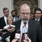 In this April 25, 2006, file photo, John Durham speaks to reporters on the steps of U.S. District Court in New Haven, Conn. (AP Photo/Bob Child, File)