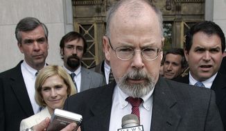 In this April 25, 2006, file photo, John Durham speaks to reporters on the steps of U.S. District Court in New Haven, Conn. (AP Photo/Bob Child, File)