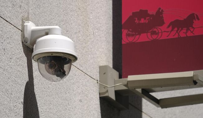 This photo taken Tuesday, May 7, 2019, shows a security camera in the Financial District of San Francisco. A civilian board that oversees Detroit police has approved the use of facial recognition technology to investigate crimes. (AP Photo/Eric Risberg) ** FILE **
