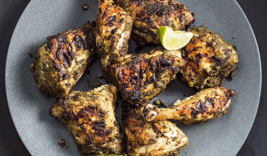 This undated photo provided by America's Test Kitchen in May 2019 shows Jerk Chicken in Brookline, Mass. This recipe appears in the cookbook "Vegetables Illustrated." (Steve Klise/America's Test Kitchen via AP)